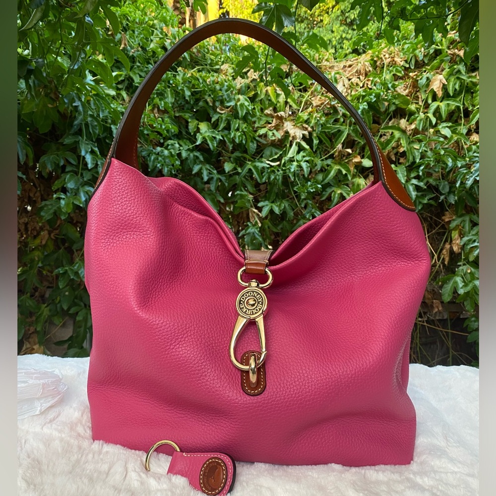 Dooney and Bourke Belvedere logo lock shoulder bag w/leather key chain.